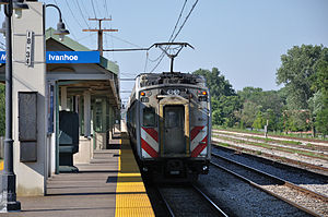 Picture of The Metra Electric District Line / Wikipedia / vxla - Flickr: Departing Metra Electric District Train at Ivanhoe

Link: https://en.wikipedia.org/wiki/Metra_Electric_District#/media/File:Departing_Metra_Electric_District_Train_at_Ivanhoe.jpg